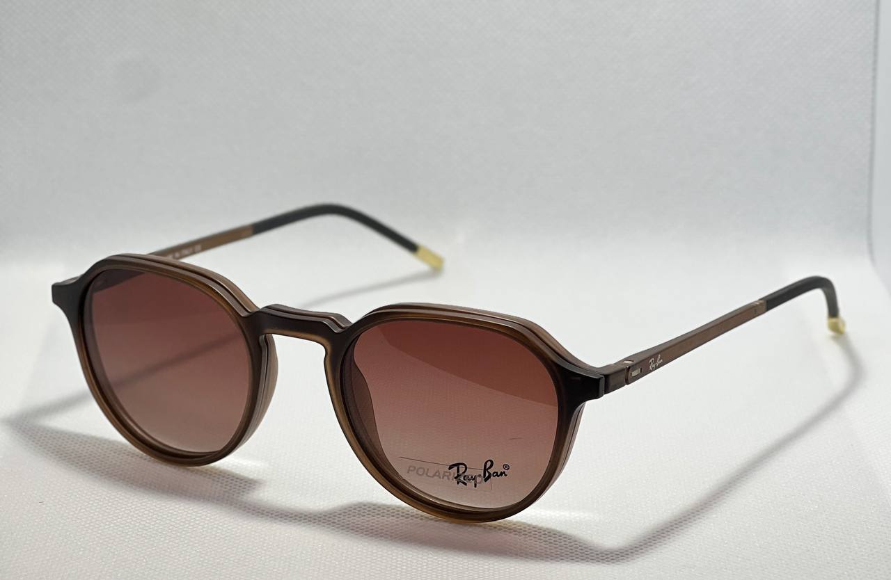 Brown round ReyBan clip on sunglasses